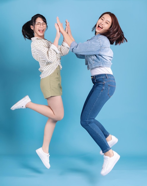 Two women on blue background