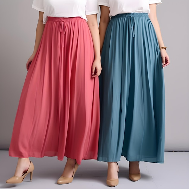 Two women in blue skirts stand side by side.