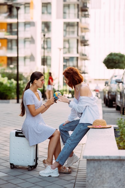 Two women on a city street Travel concept