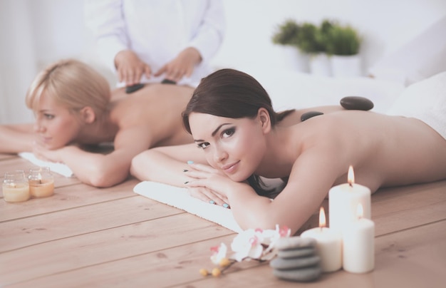 Two women getting a massage in a spa