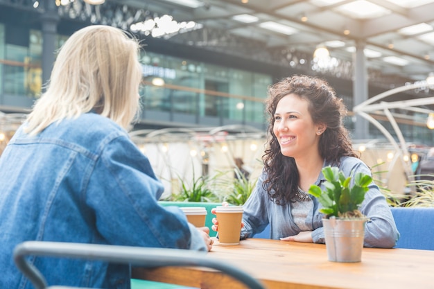 Two women having a coffee together in London