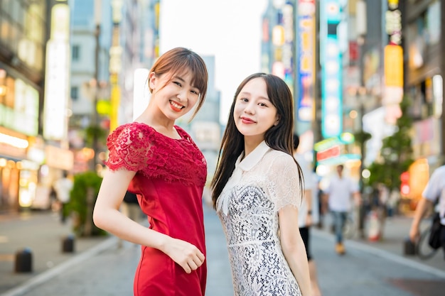 Two women posing in downtown