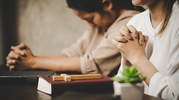 Two women praying worship believe