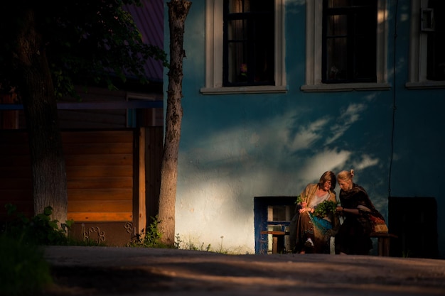 Two women sitting on a bench in Borovsk.