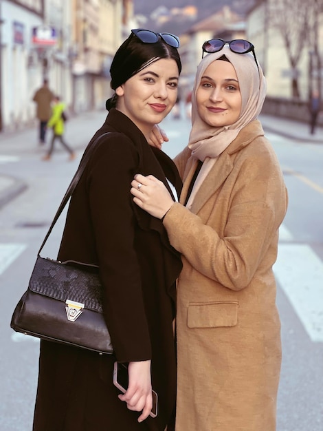 Two women standing on a street in milan