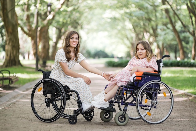 Two women with disability enjoying summer at green park