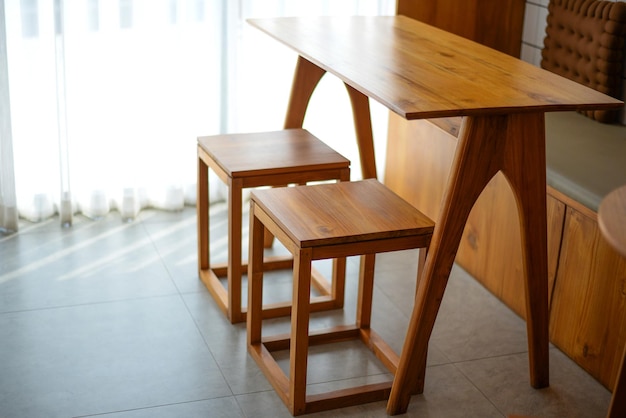 Two wooden chair with wooden table