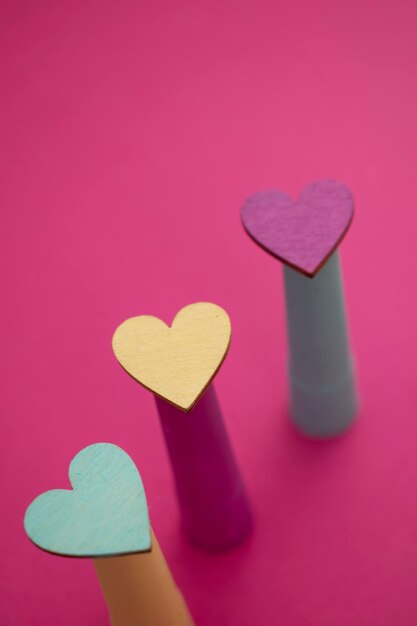Two wooden hearts with a heart on the top
