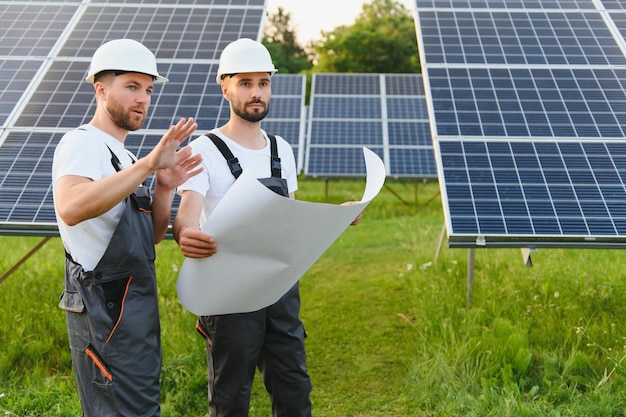 Two workers working on a solar panel