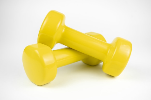 Two yellow dumbbells  