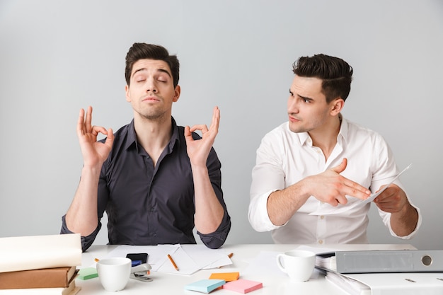 Two young business men colleagues