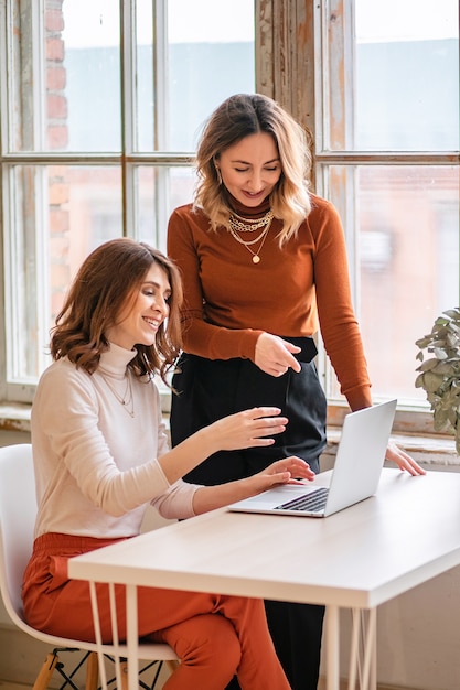 Two young business women in the office