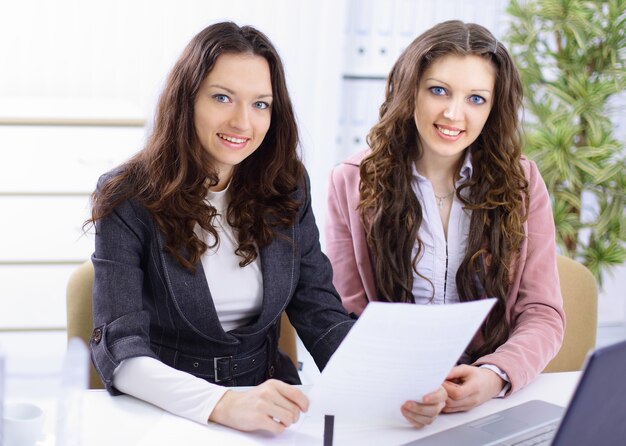 two young business women working in an office