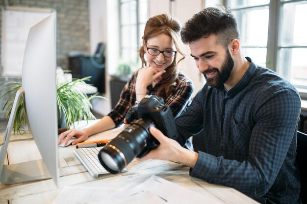 Two young designers working in modern office