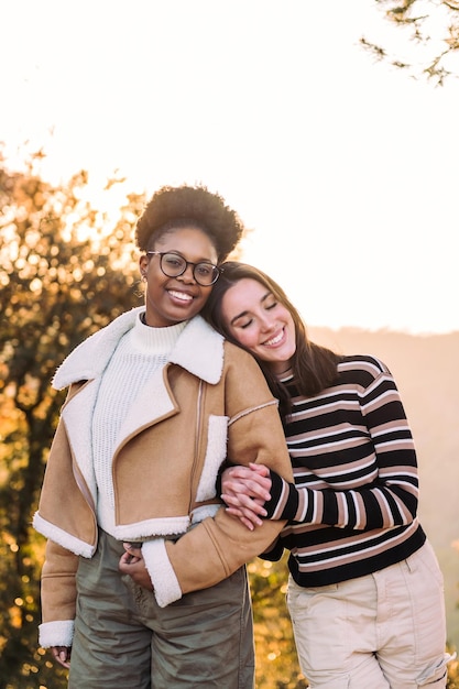 Two young friends smiling happy in nature