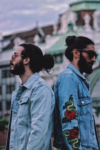 Two young men standing outdoors