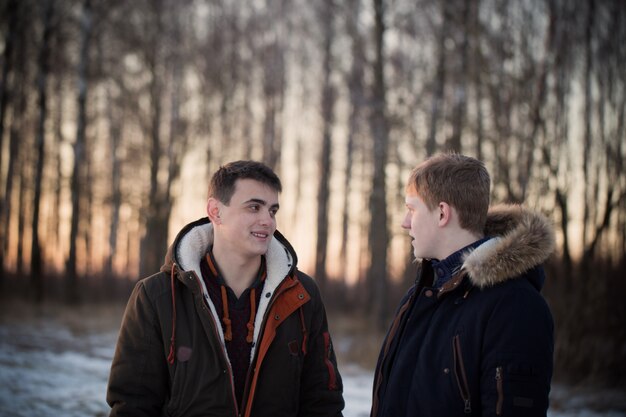 Two young men in winter park