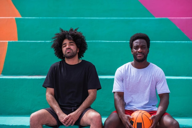Photo two young men with afro hair style on colorful background