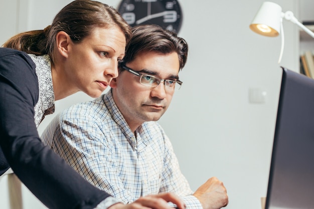 two young people working late