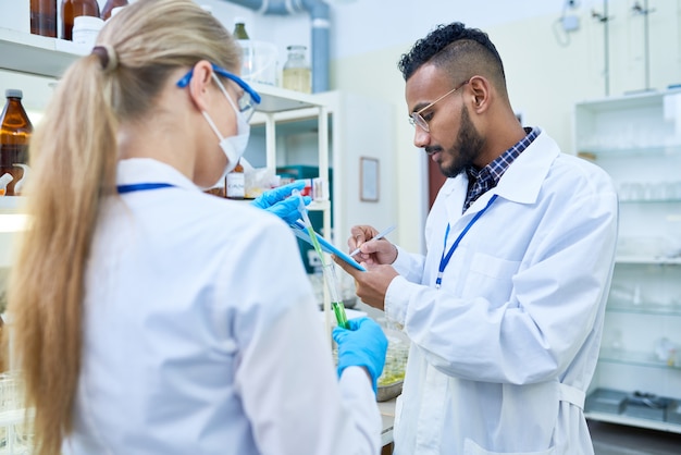 Two Young Scientists in Laboratory