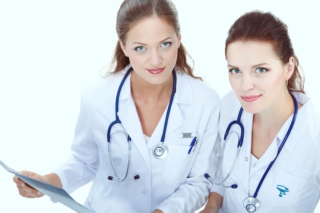 Two young woman doctor standing in hospital