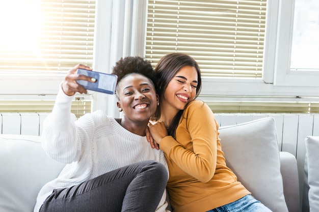 Two young women having fun at home