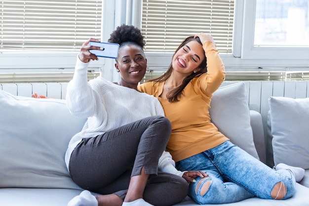 Two young women having fun at home