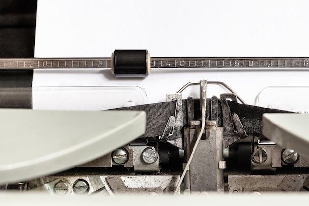 Typebar types ink ribbon in mechanical typewriter