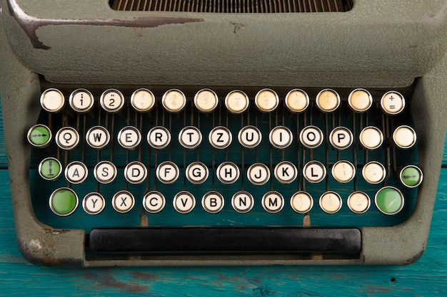 Typewriter on the blue wooden desk