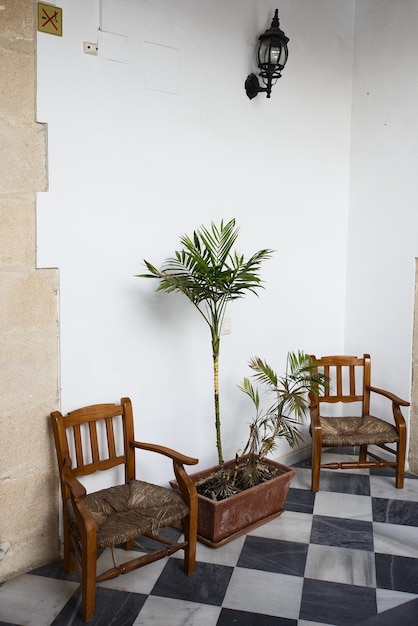 Typical Andalusian patio with two chairs and a plant