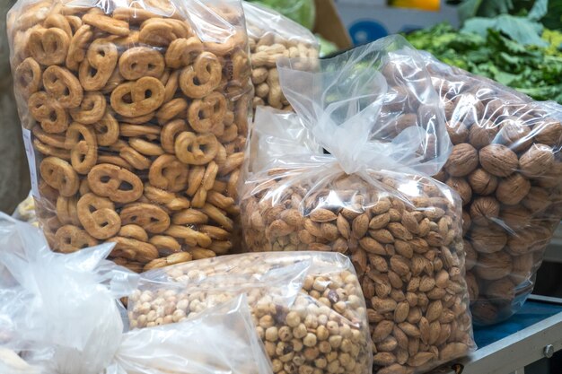 Photo typical apulian taralli hazelnuts almonds and walnuts in transparent plastic bags