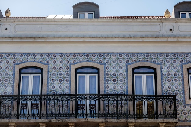 Typical architecture of the capital Lisbon city streets and people