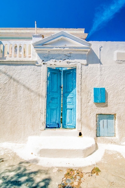 Photo typical blue door in emporio on the island of santorini greece dramatic toned