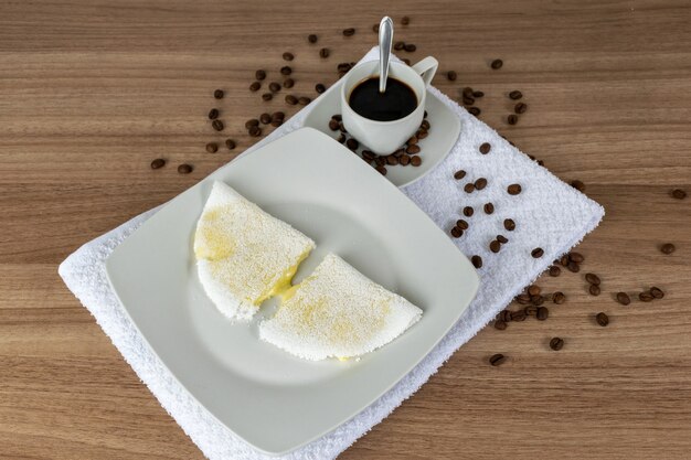 Typical Brazilian bread (tapioca) with melted mozzarella cheese and coffee.