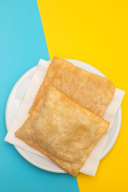 Typical brazilian fried pastry on white plate