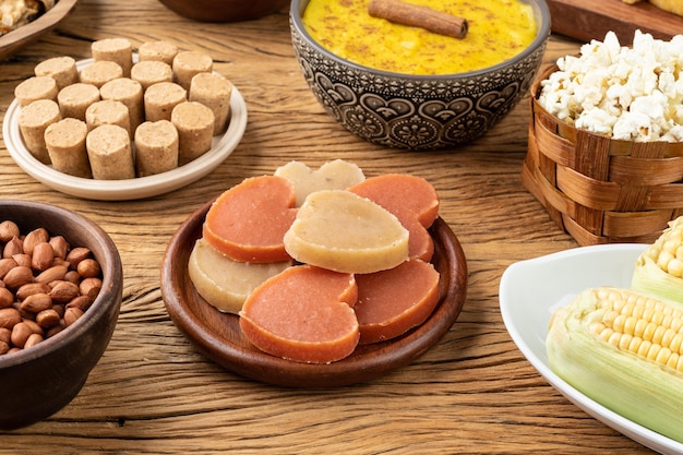 Typical brazilian june festival food over wooden table Festa junina