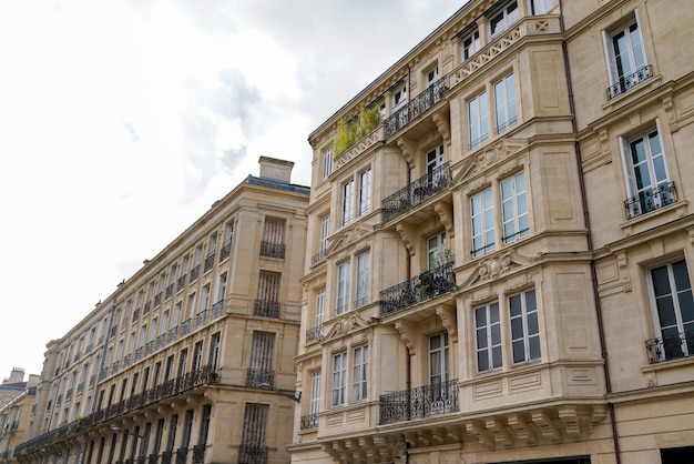 Typical design of Parisian architecture hausmann facade of french building in block of apartments in bordeaux France