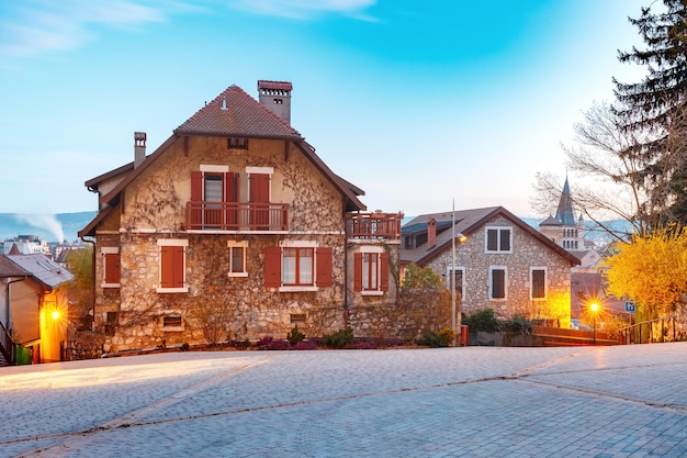 Typical french houses in old town of annecy during morning blue hour france