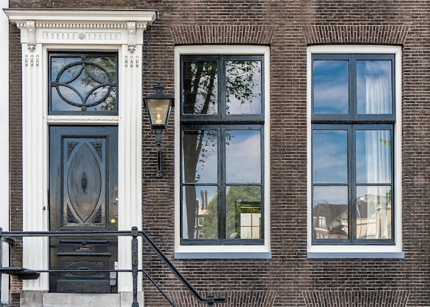 Typical house entrance with door windows in the old town of Amsterdam Netherlands