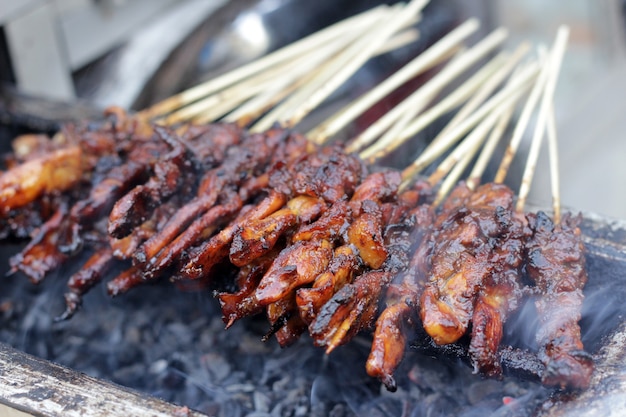 typical Indonesian food made from chicken meat cooked by burning.