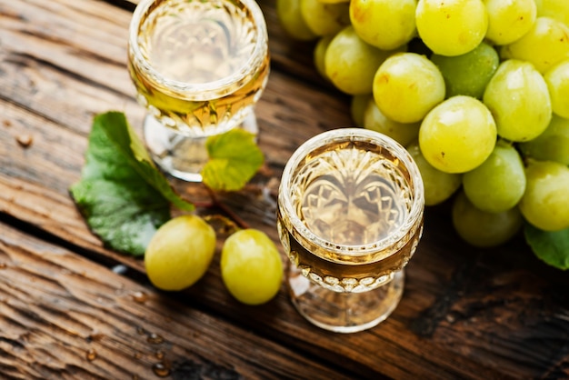 Typical Italian gold grappa in glasses