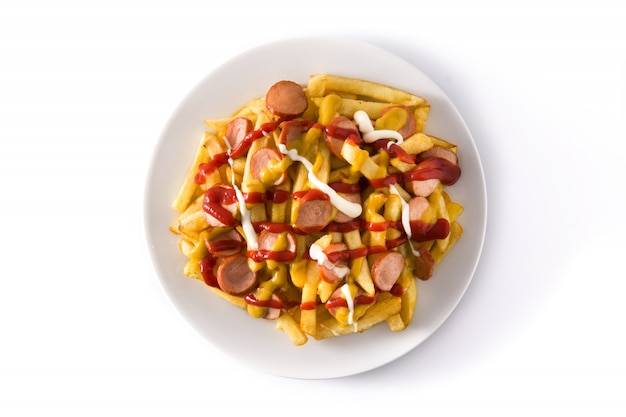 Typical Latin America Salchipapa. Sausages with fries, ketchup, mustard and mayo isolated on white surface Top view