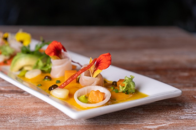 Photo typical peruvian dish, fish tiradito in different sauces.