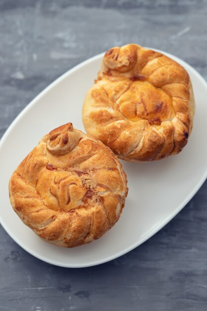 Typical portuguese and brazilian chicken small pies on white dish