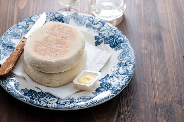 Typical portuguese bread of Madeira Bolo do caco with butter