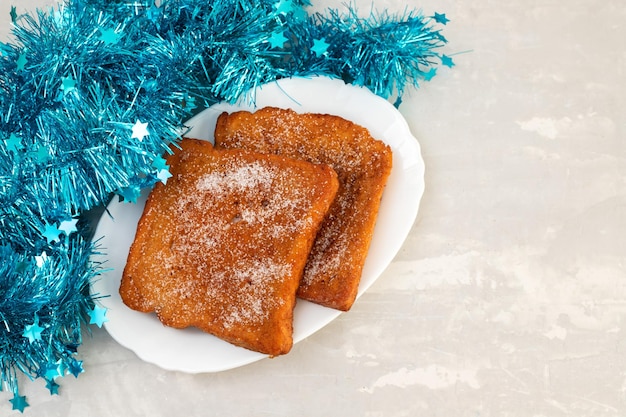 Typical portuguese Christmas dessert fried bread with cinnamon