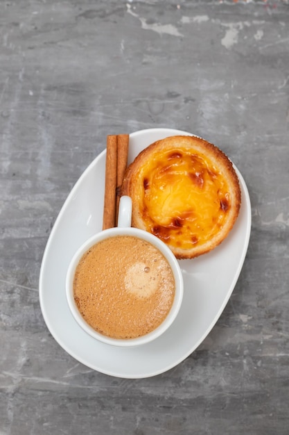 Typical portuguese dessert pastel de nata with coffee