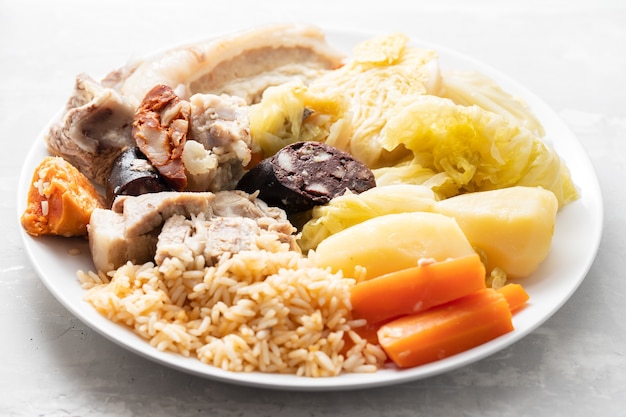 Typical portuguese dish cozido a portuguesa on white dish