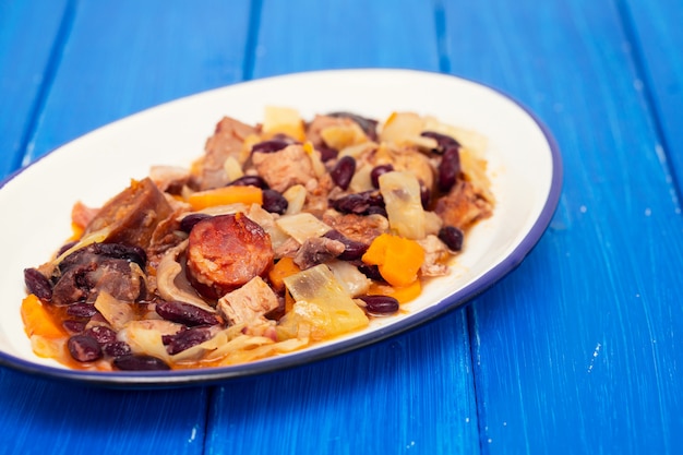 Typical Portuguese dish feijoada transmontana on white plate