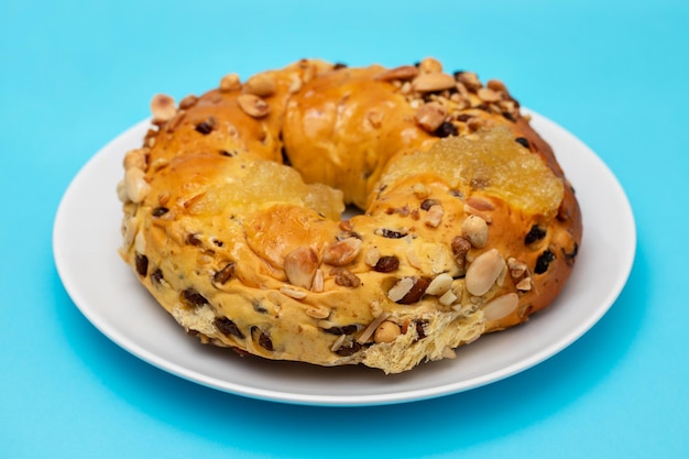 Typical portuguese fruit cake Bolo rainha on white dish